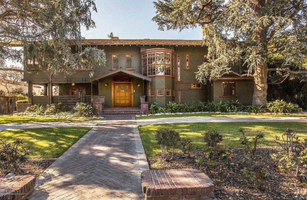 Front walkway leading to The Dr. William T. Bolton House #3 with view of the main facade and entry pergola.