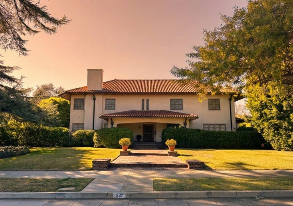 Street view of The Judge Joseph H. Pryor House at 227 Oaklawn Avenue with red tile roof and stucco walls.