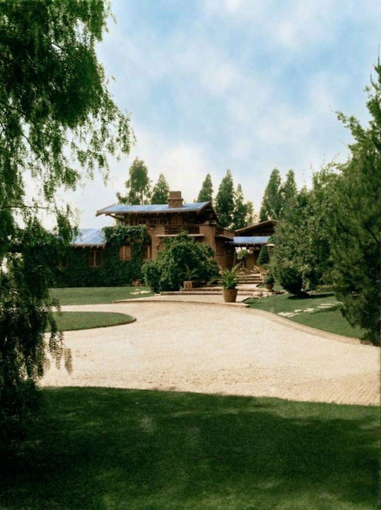 Historic colorized photograph showing the east facade and driveway view of the Freeman A. Ford House.