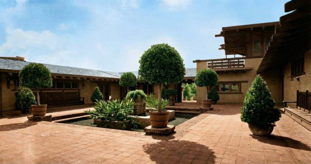 Historic colorized photograph of the courtyard entrance to the Freeman A. Ford House.