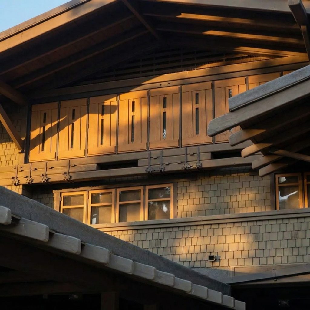 Attic detail at the northeast corner of The Mary E. Cole House showing exposed timber beams and wood shingle siding