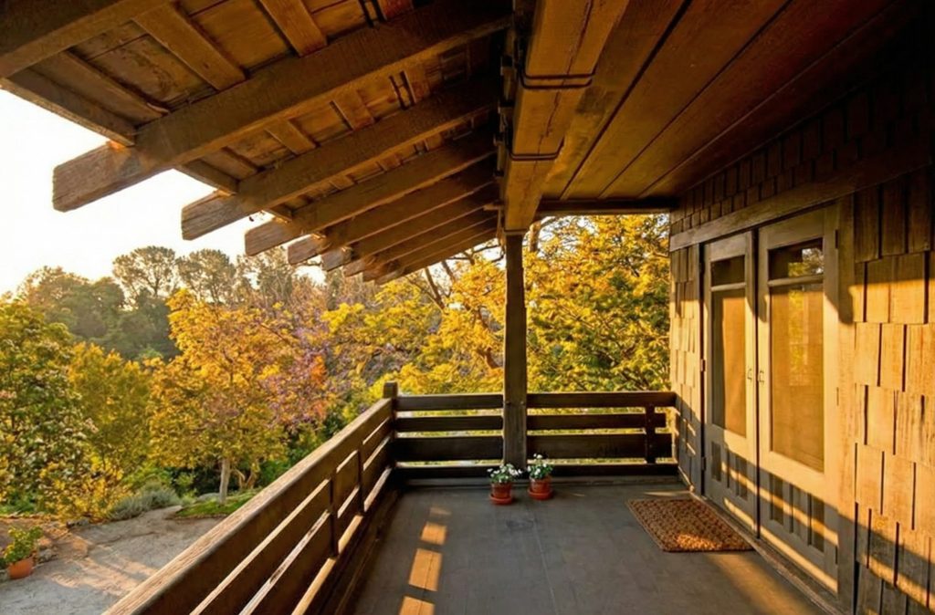 Sleeping porch with cedar shingles and horizontal railings at The Margaret B. S. Clapham Spinks House.