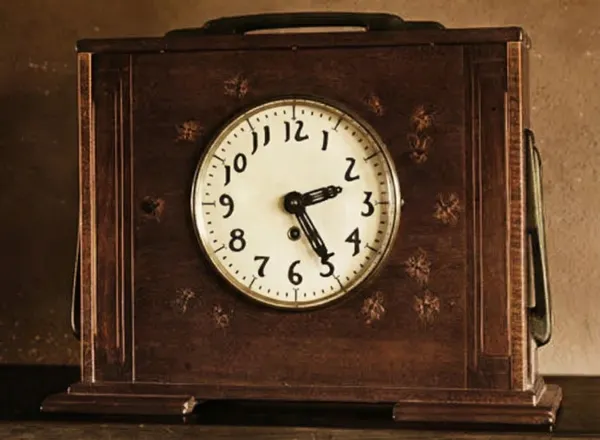 Mahogany mantle clock with ebony pegs and carrying handle from the Mrs. Belle Barlow Bush furniture collection