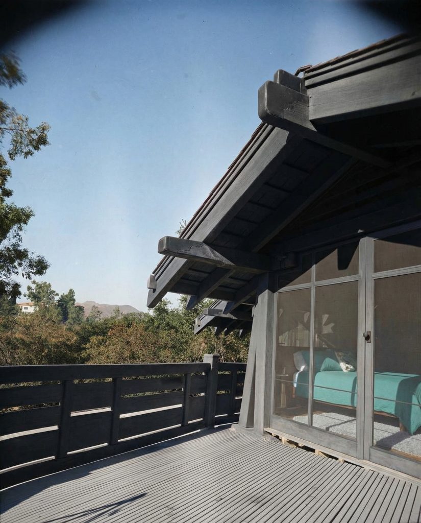 Alternate colorized second floor terrace view of The Charles M. Pratt House showing wood details and garden overlook