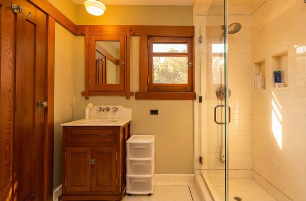 Bathroom featuring period tilework and updated fixtures at The Margaret B. S. Clapham Spinks House.