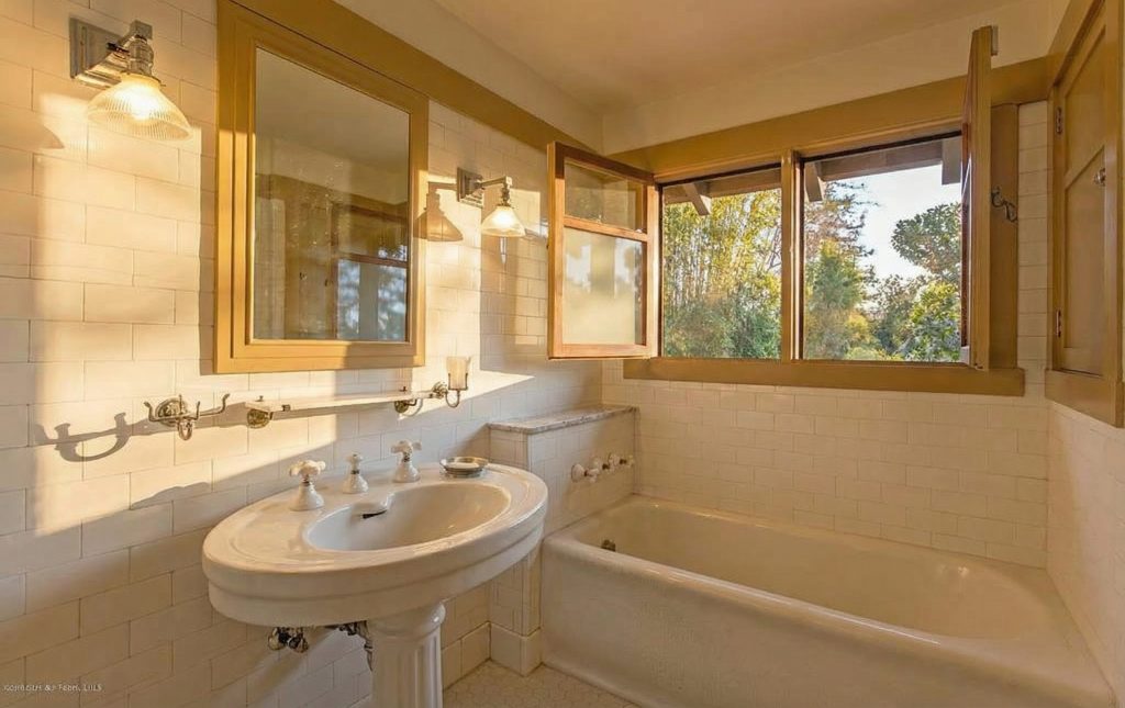 Bathroom 3 at The Dr. William T. Bolton House #3 showcasing elegant tilework and classic design elements.