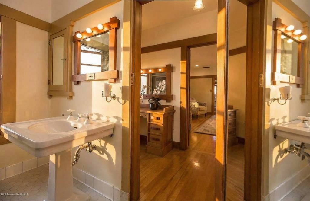 Bathroom 4 at The Dr. William T. Bolton House #3 displaying restored fixtures and matte-glazed tile.