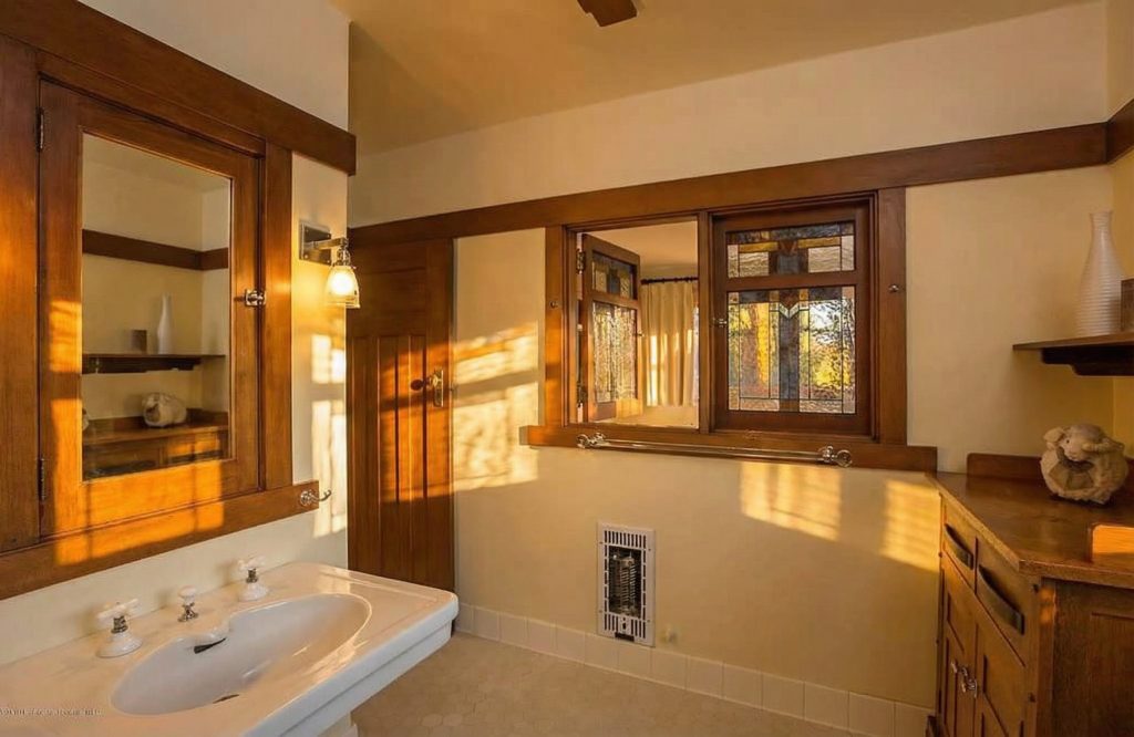 Bathroom 5 at The Dr. William T. Bolton House #3 with pedestal sink and vintage brass fittings.