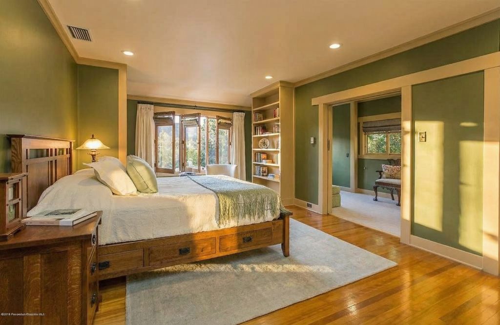 Bedroom 1 at The Dr. William T. Bolton House #3 featuring handcrafted woodwork and serene atmosphere.
