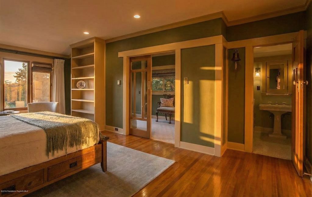 Alternate view of Bedroom 1 at The Dr. William T. Bolton House #3 showing built-in furniture and natural light.