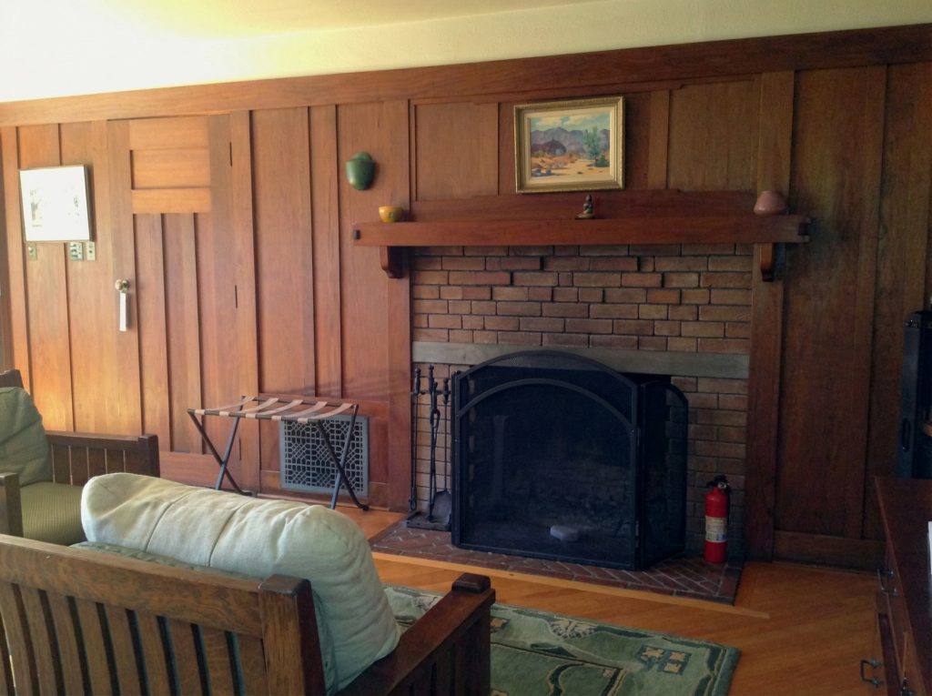 Alternate third bedroom sitting area fireplace of The Charles M. Pratt House with tile surround and built-in seating
