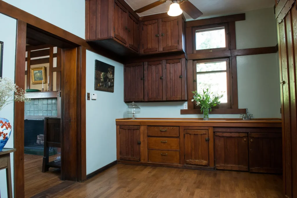 Butler's pantry of The Duncan-Irwin House featuring original built-in cabinets and craftsman details.