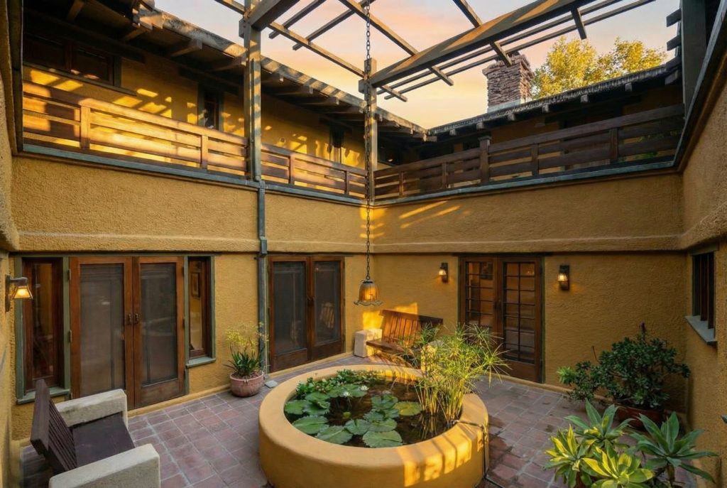 The Duncan-Irwin House courtyard from second-floor mezzanine showing French doors and natural light.