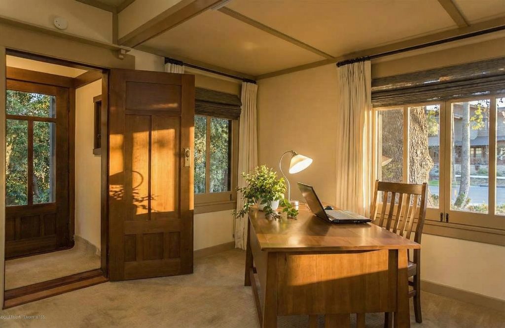 First floor office at The Dr. William T. Bolton House #3 featuring built-in bookcases and natural light.
