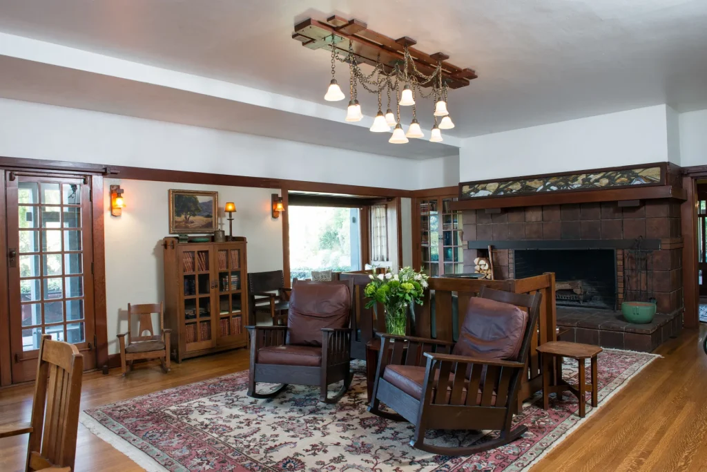 The Duncan-Irwin House great room with soaring ceiling, massive fireplace, and authentic period furnishings.