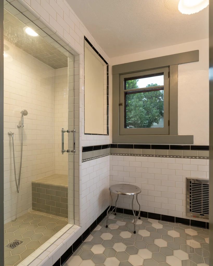 Guest house bathroom of The Duncan-Irwin House with vintage-inspired fixtures and tile work.