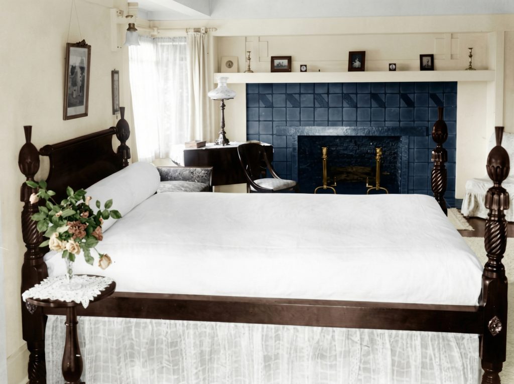 Historic photograph of Molly Craig Hobbs' bedroom in The Duncan-Irwin House with period furnishings.