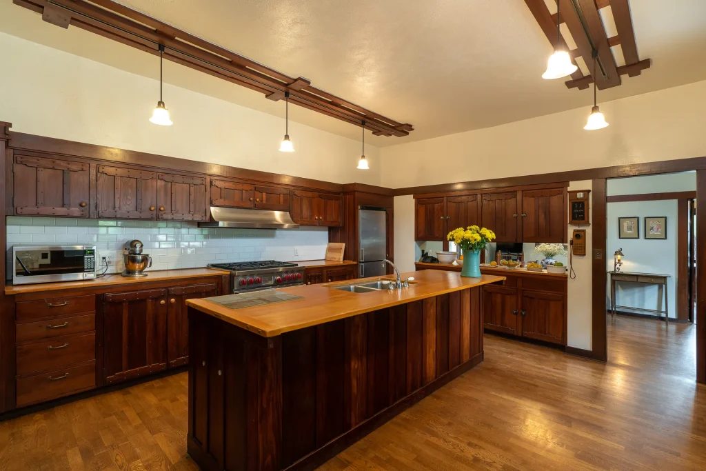 The Duncan-Irwin House kitchen with large central island, modern amenities, and historic character.