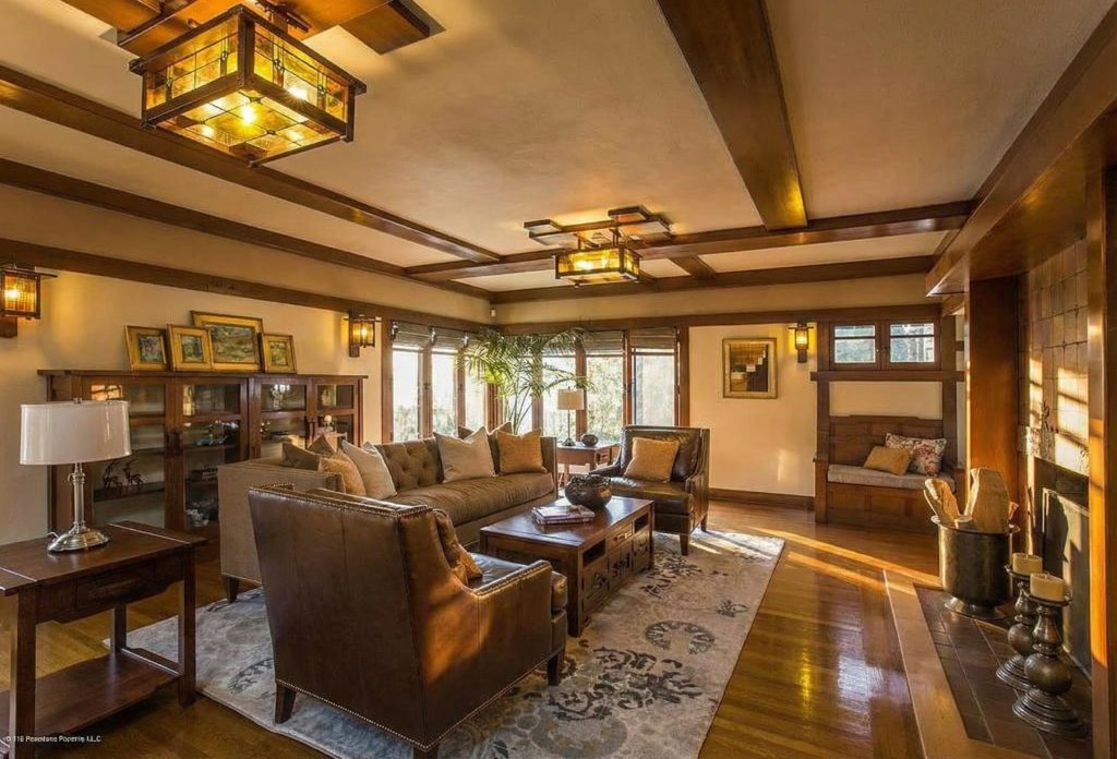 Living room at The Dr. William T. Bolton House #3 featuring exposed ceiling beams and natural light.