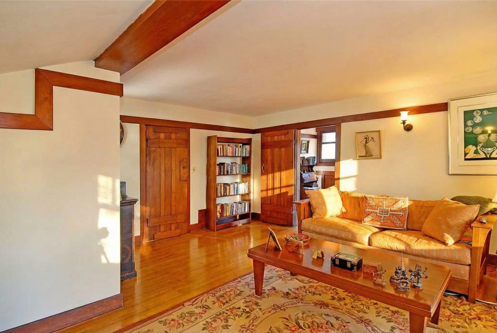 Another bedroom in The Caroline S. de Forest House, featuring a cozy sitting area with beautiful hand-built.