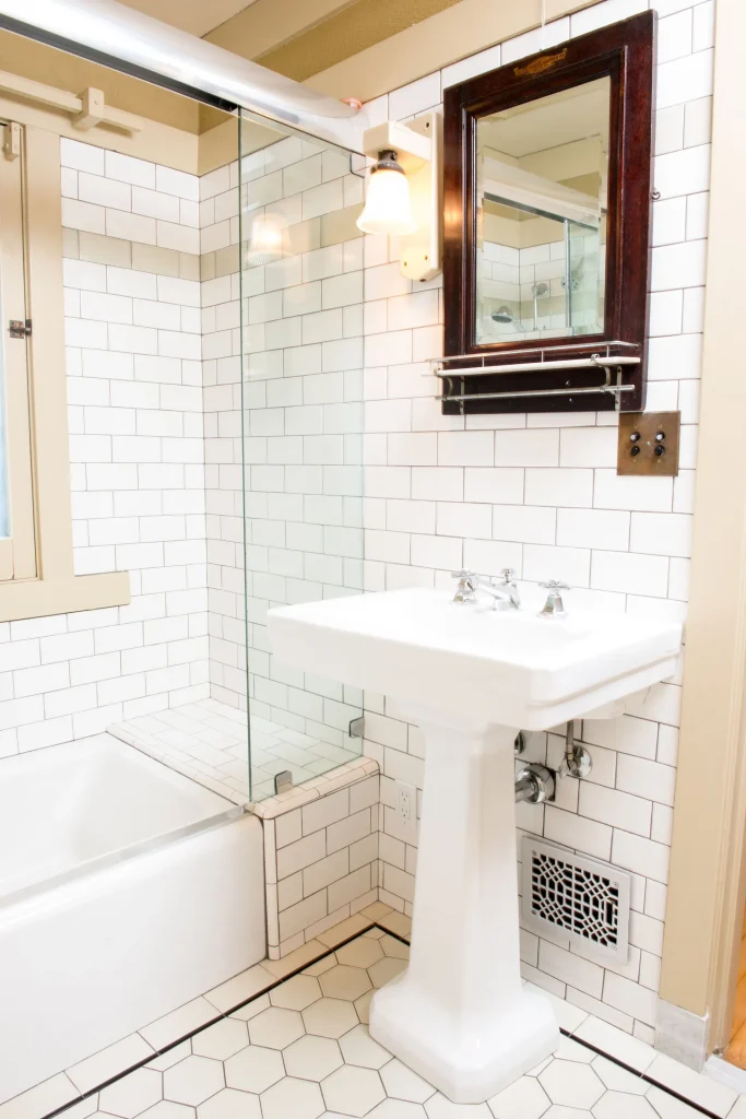 Upstairs bathroom No. 2 of The Duncan-Irwin House with period tile and restored craftsman details.