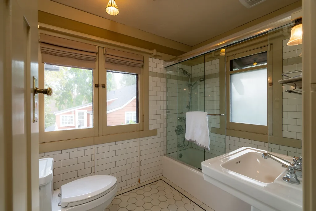 Alternate view of The Duncan-Irwin House upstairs bathroom No. 2 with vintage fixtures and tile.