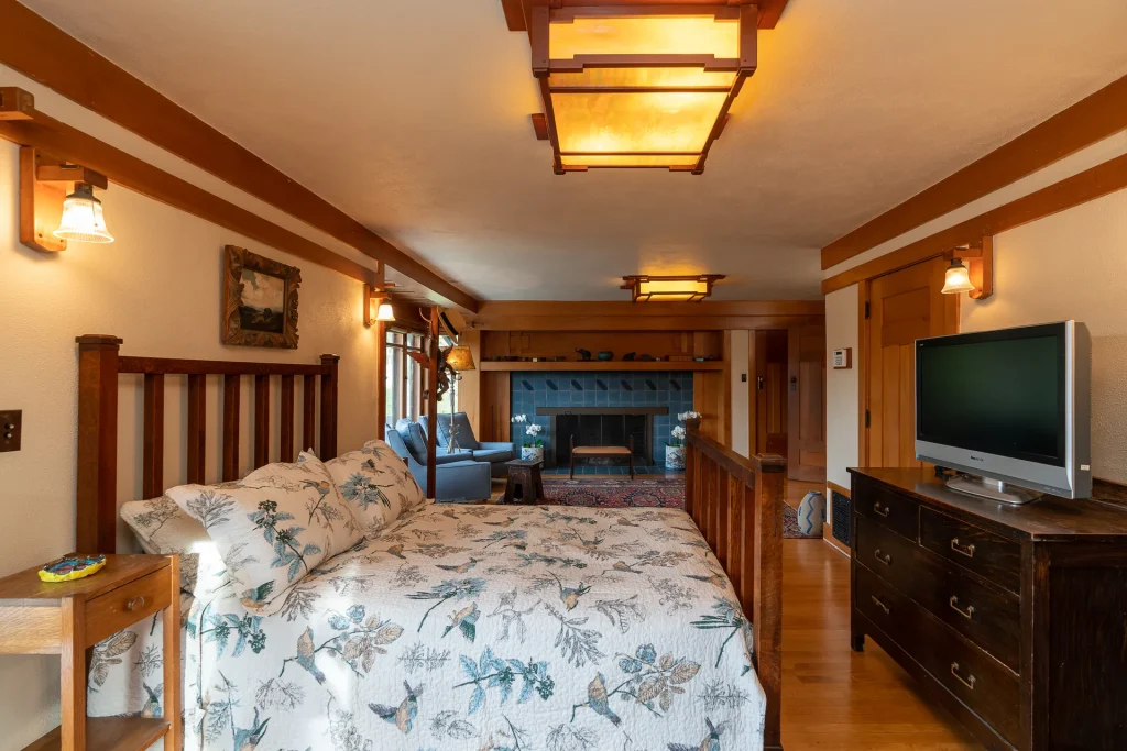 Second-floor bedroom No. 3 of The Duncan-Irwin House featuring craftsman details and natural light.