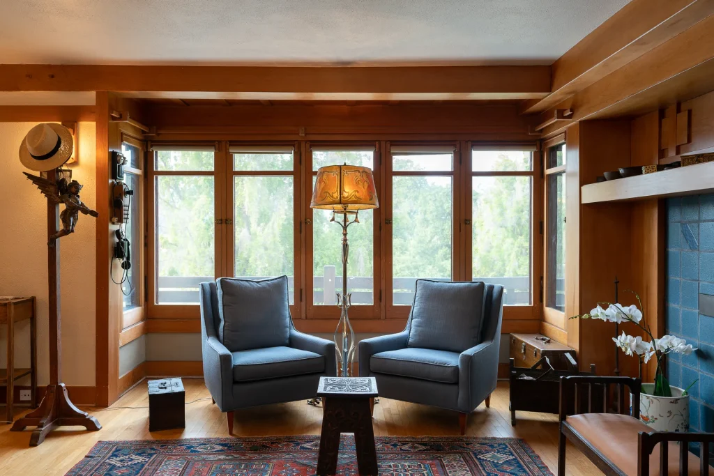 Sitting area in bedroom No. 3 of The Duncan-Irwin House with period furnishings and wood details.