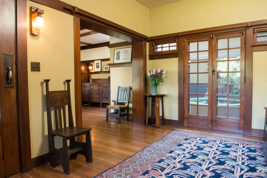 Alternate view into The Duncan-Irwin House dining room revealing architectural flow and wood detailing.