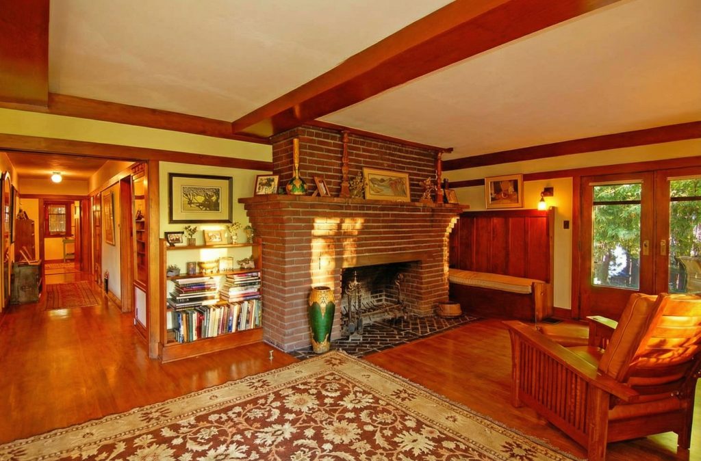A view from the fireplace down a hallway in The Caroline S. de Forest House, showing the home's warm wood tones.