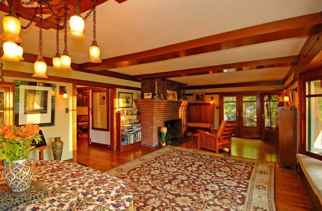A view from the dining area into the living room of The Caroline S. de Forest House, showing the open flow of the space.