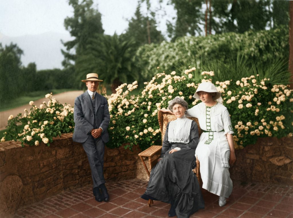 Historic photograph of the Irwin family on The Duncan-Irwin House terrace in early 20th century.