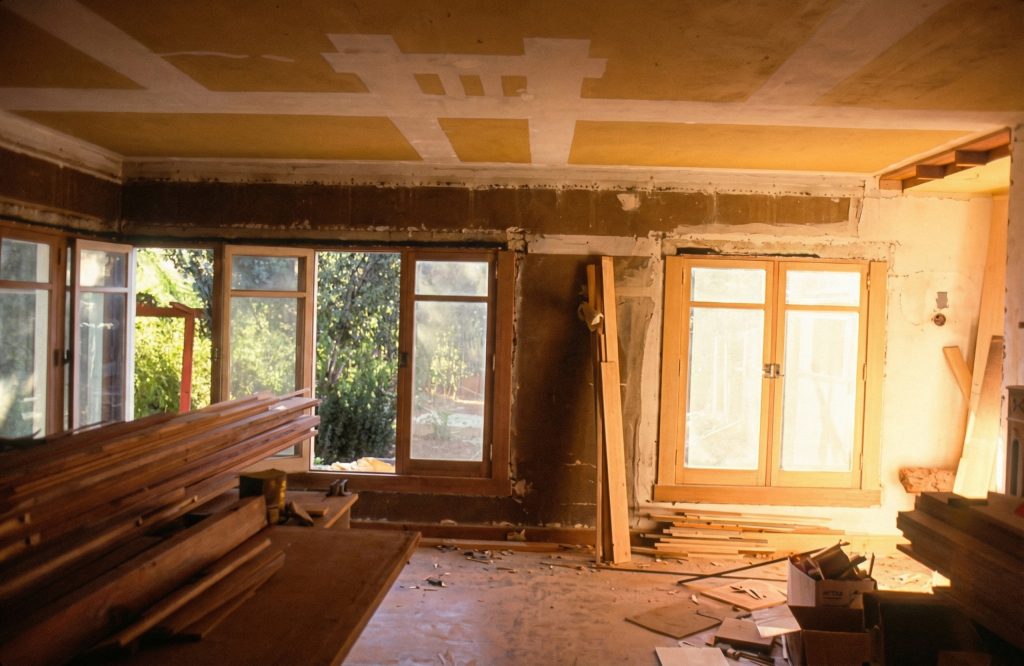 Restoration photograph of the living room at The Dr. William T. Bolton House #3 during renovation work.