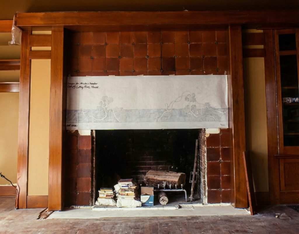 Restoration detail of fireplace tilework at The Dr. William T. Bolton House #3 revealing Grueby tiles.