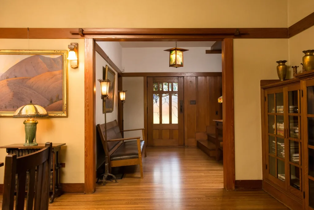 View into The Duncan-Irwin House entryway showcasing Emil Lange art glass and craftsman interior.