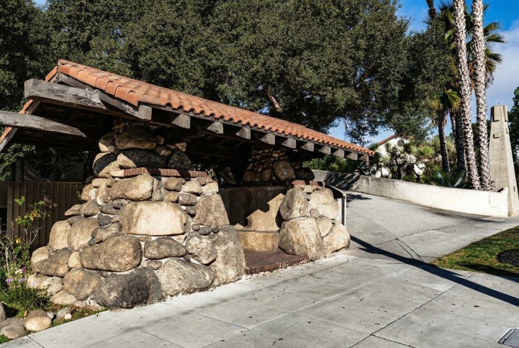 The Oaklawn Bridge Waiting Station with its Arroyo Seco boulder walls, clay tile roof, and exposed redwood beams by Greene & Greene.