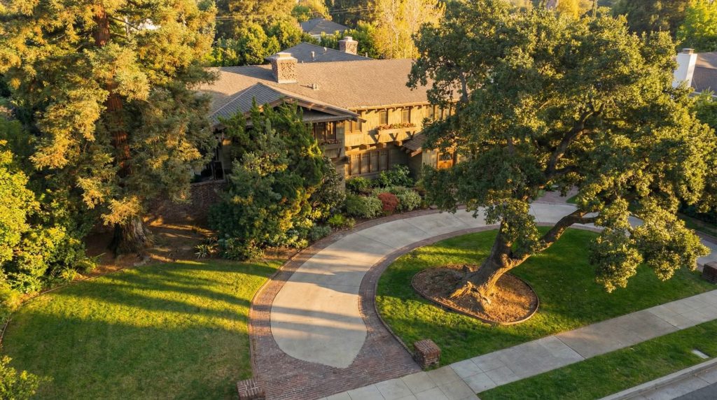 Aerial view of The Earle C. Anthony house and its expansive grounds nestled among mature trees in Beverly Hills
