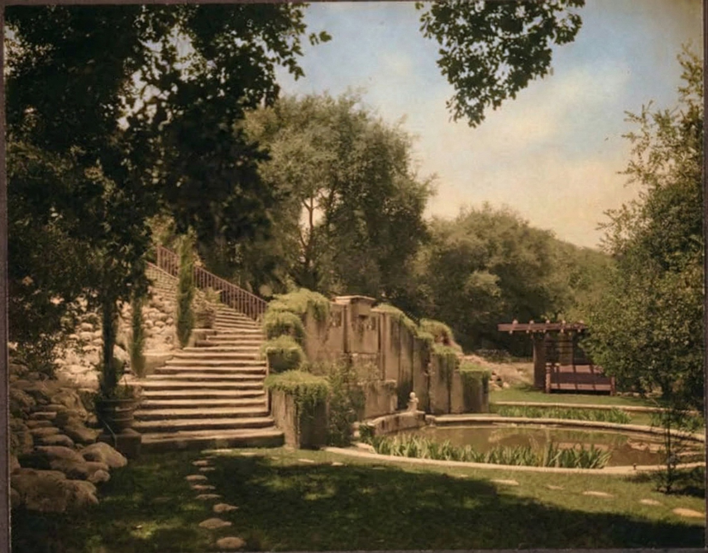 Photograph circa 1915 of the lower formal garden of the Cordelia A. Culbertson House, a rectangular reflecting pool at the base of a planted slope with stone steps descending toward it