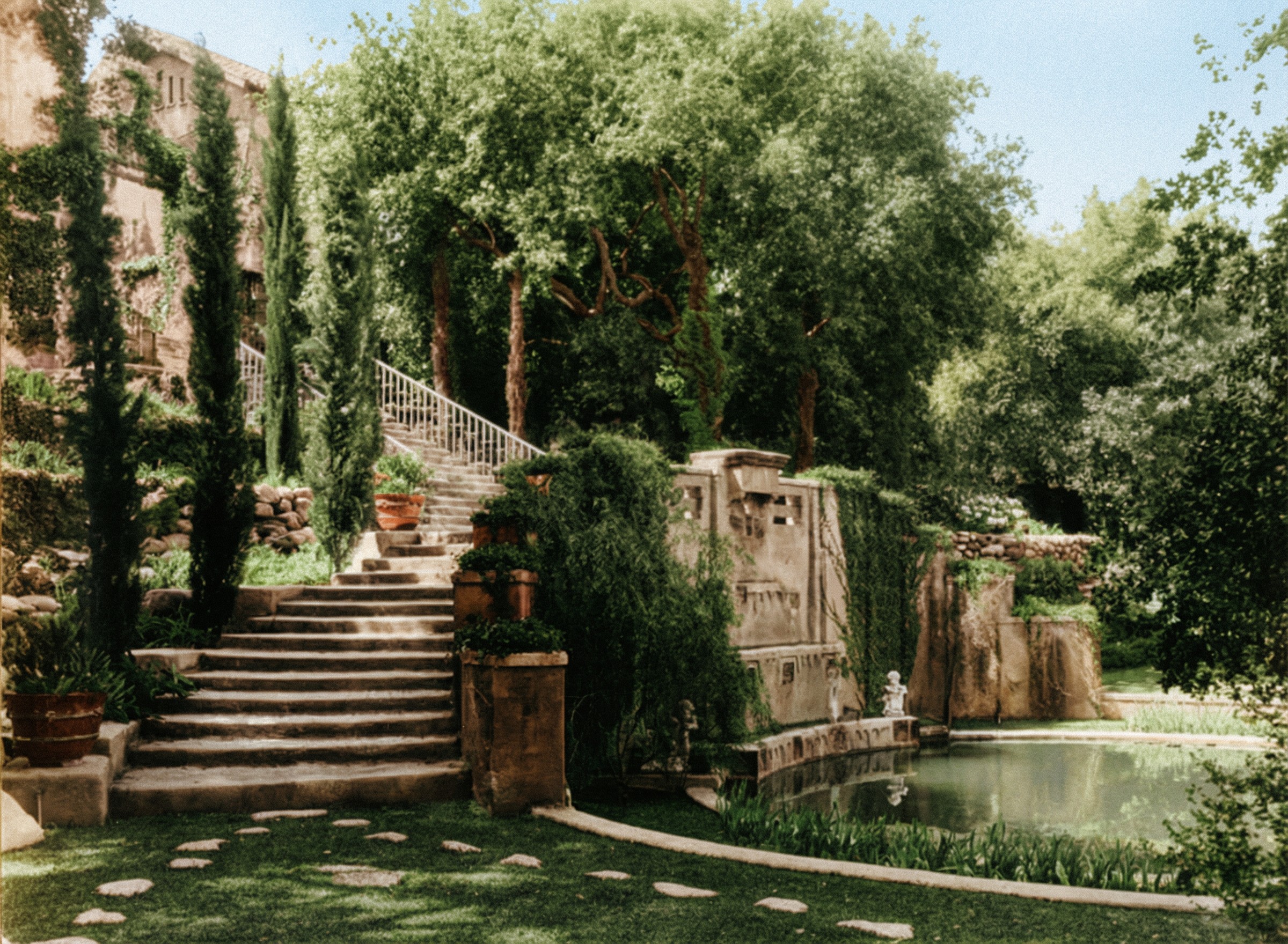 Photograph circa 1917 of curving garden staircases at the Cordelia A. Culbertson House descending a steep landscaped slope in symmetrical flights between planted terraces