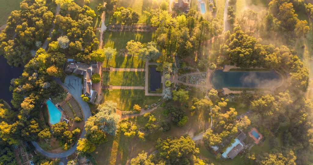 A stunning contemporary sky view photo of The Mortimer Fleishhacker Estate, showing the property from a unique aerial perspective.
