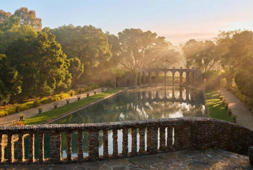 The Roman pool terrace at The Mortimer Fleishhacker Estate, looking south towards the open arcade and rolling hills.