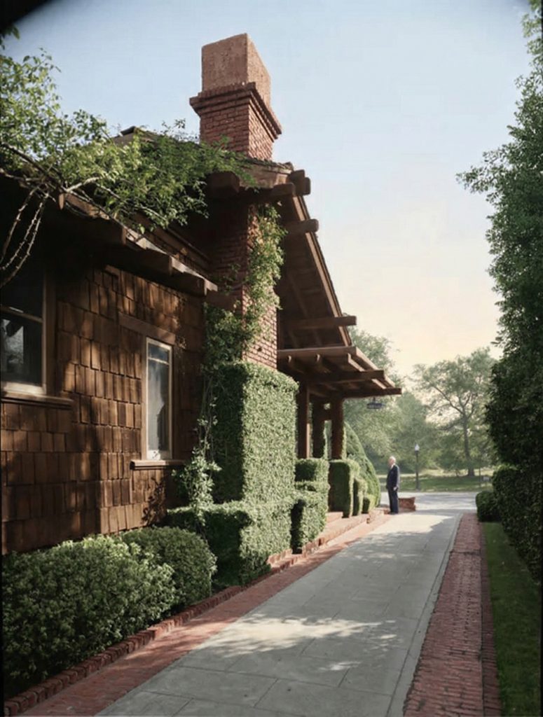 Maynard Parker's mid-century photograph of the paved court and drive at The Dr. S. S. Crow House, showing the mature state of the front landscape.