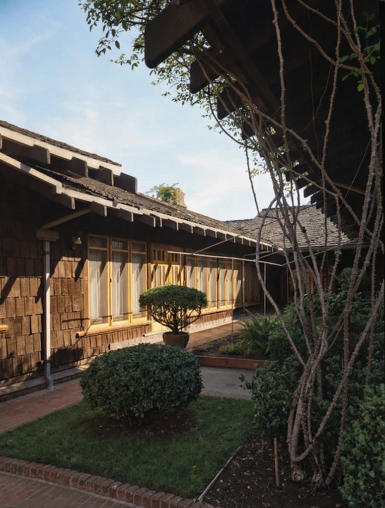 A mid-century Maynard Parker photograph of the lush, mature central courtyard of The Dr. S. S. Crow House, the private heart of the U-shaped home.