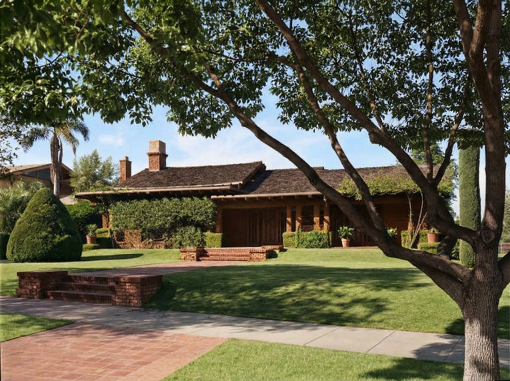Maynard Parker's mid-century front perspective of The Dr. S. S. Crow House, capturing the home's timeless elegance and settled, mature landscape.