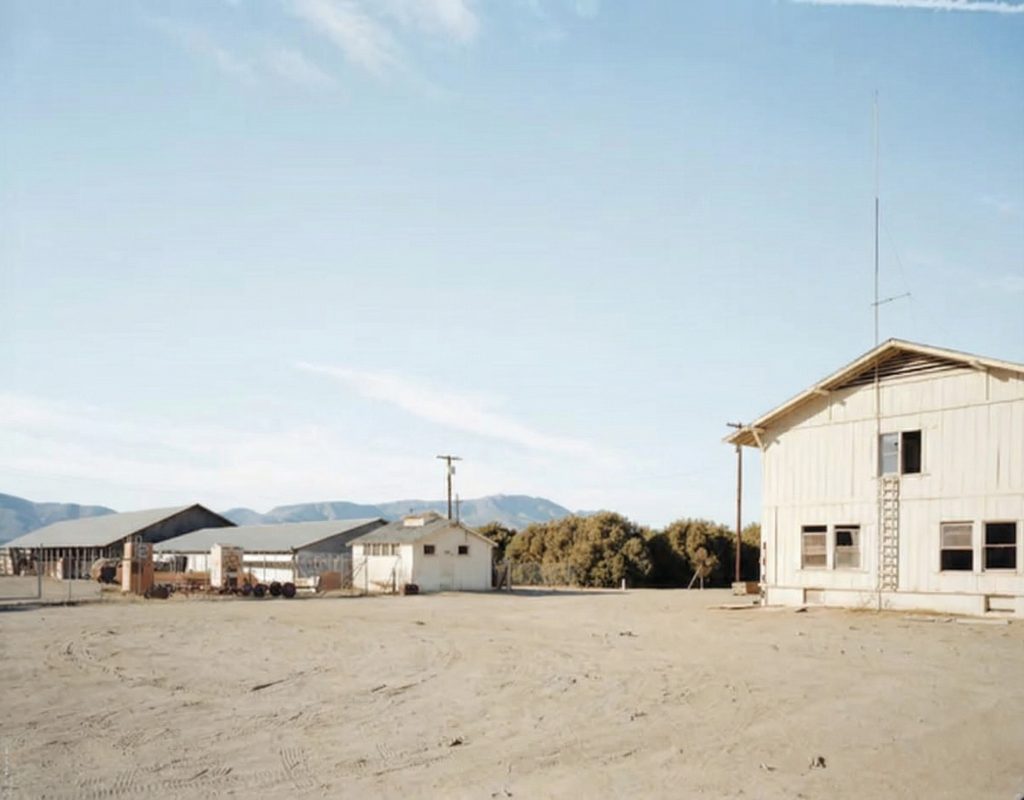 Exterior photograph of the east side of The Sespe Ranch Bunkhouse showing the full two-story facade and shingled gable roof