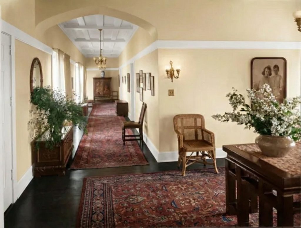 A long, sunlit hallway within The Mortimer Fleishhacker Estate in 1915, showing the graceful lines of the interior.