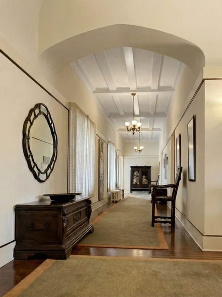 A 1975 HABS survey view looking east down a hallway in The Mortimer Fleishhacker Estate, showing its length and simplicity.