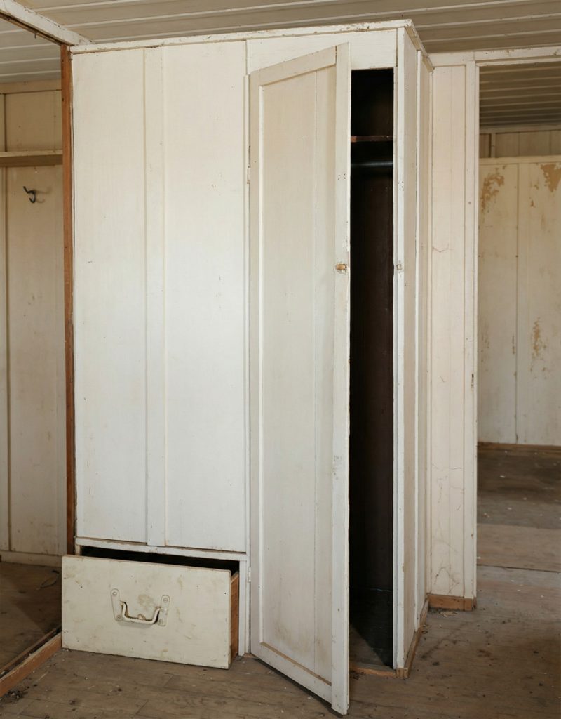 Interior detail of a built-in closet in The Sespe Ranch Bunkhouse demonstrating the practical storage design for worker quarters