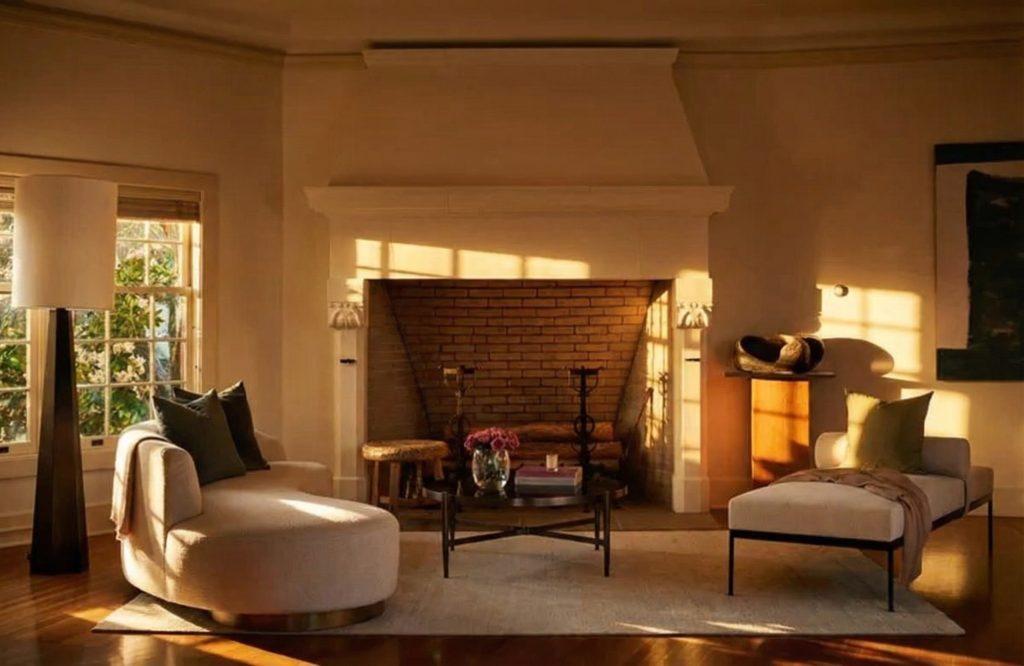 A contemporary photo of a fireplace in The Mortimer Fleishhacker Estate, a warm and inviting focal point of the room.