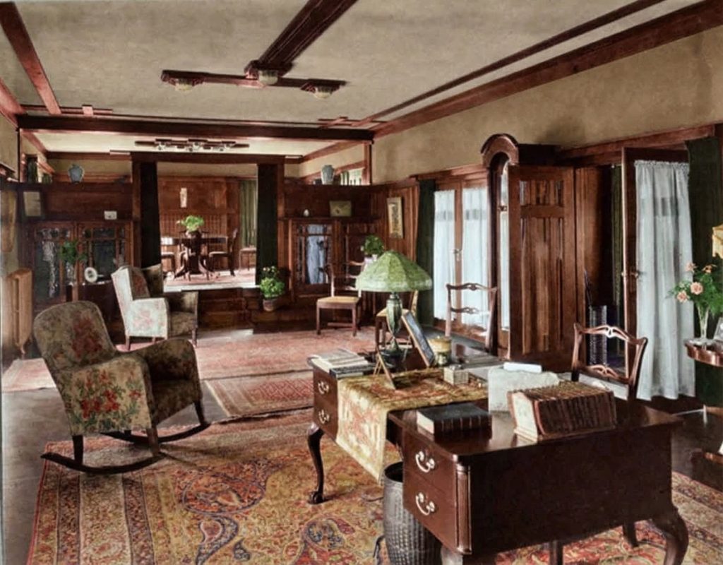 Leroy Hulbert's 1915 photograph of the living room in The Dr. S. S. Crow House, showing the original furniture arrangement and fireplace.